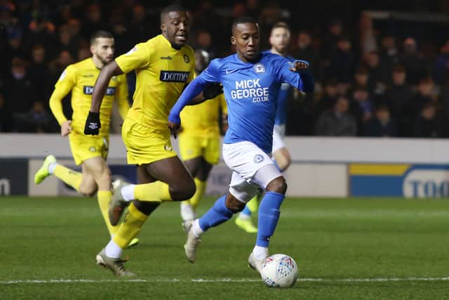 Siriki Dembele of Peterborough United in action with Nnamdi Ofoborh of Wycombe Wanderers. Photo: Joe Dent/theposh.com.