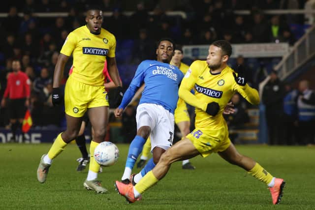 Reece Brown of Peterborough United in action with Curtis Thompson of Wycombe Wanderers. Photo: Joe Dent/theposh.com.