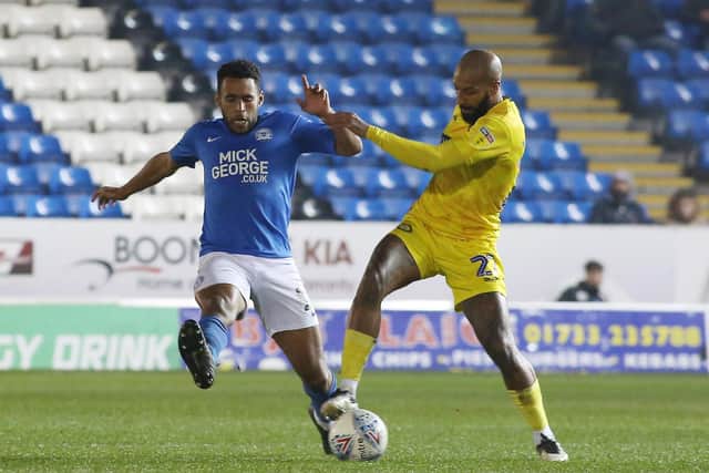 Nathan Thompson of Peterborough United in action with Josh Parker of Wycombe Wanderers. Photo: Joe Dent/theposh.com.