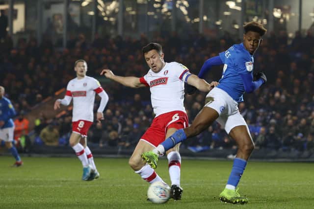 Ricky-Jade Jones of Peterborough United in action with Richard Wood of Rotherham United. Photo: Joe Dent/theposh.com.