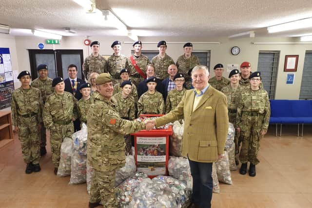 The handover of the recycled cans