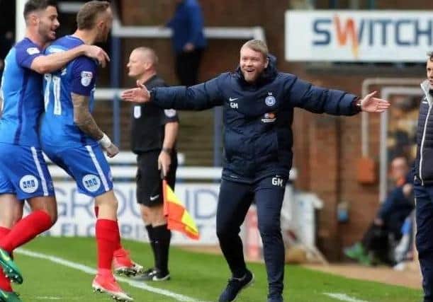 Marcus Maddison celebrates a goal with then Posh manager Grant McCann.