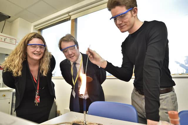 MP for Peterborough Paul Bristow visiting Queen Katharine Academy talking to student Andrei Dobrica and principal Lynn Mayes. EMN-200124-190515009