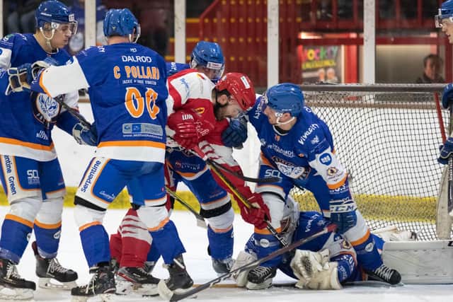 Phantoms put up a strong defensive rearguard to stop Swindon's player coach Aaron Nell. Photo: Tom Scott.