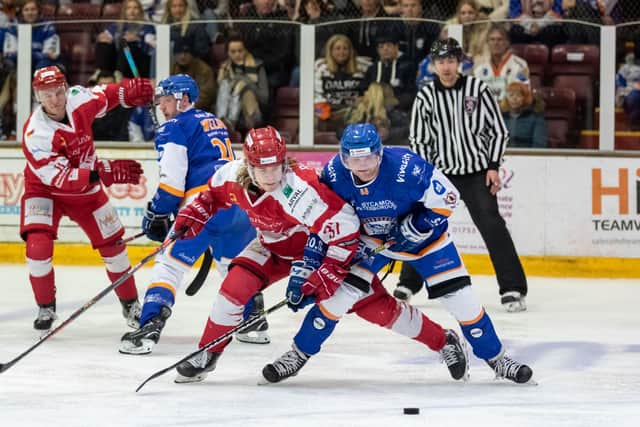 Conor Pollard of Phantoms (right) battles with Swindon's Toms Rutkis. Photo: Tom Scott.