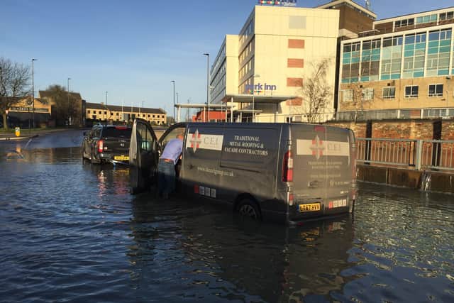 A van is rescued from the floods