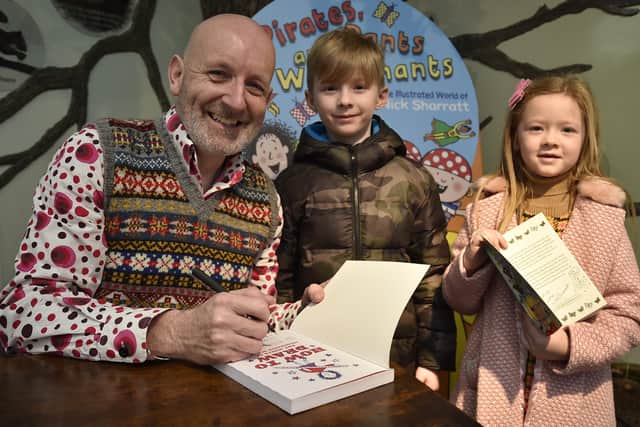 Nick Sharratt  book signing  at Peterborough Museum. Ellis and Orlah Trimmer  with the author. EMN-201101-161930009