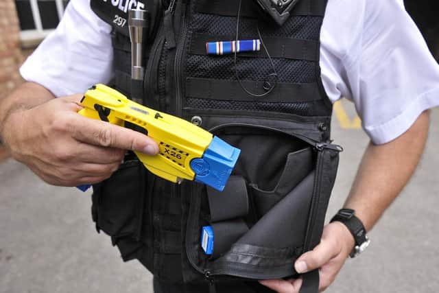 A police officer with his Taser. Photograph: Ben Birchall/PA Wire