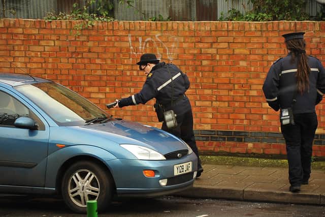 Traffic wardens giving out parking ticket ENGEMN00120121227180035