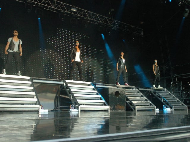JLS with Aston Merrygold are pictured preforming on the embankment in Peterborough