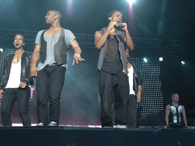 JLS with Aston Merrygold are pictured preforming on the embankment in Peterborough