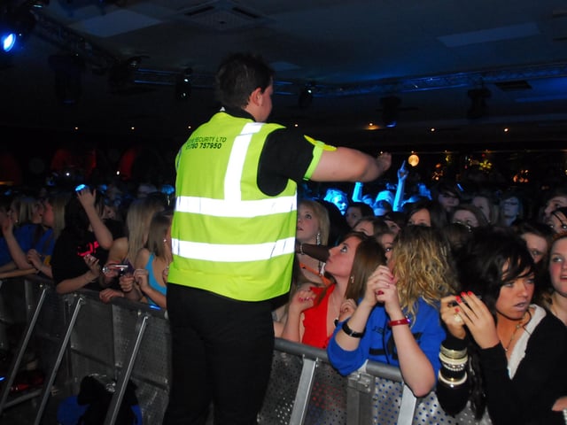 JLS under 18s gig at Club Metro, Peterborough. Stewards try to control the heaving crowd