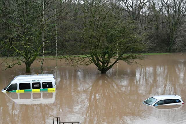 Submerged vehicles after flooding in Nantgarw, Wales, as Storm Dennis hits the UK. Photo: Ben Birchall/PA Wire