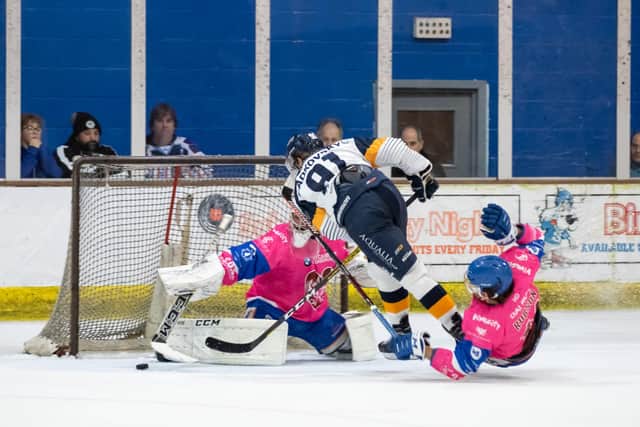 Phantoms netminder Ryan Bainborough and Scott Robson combine to thwart Raiders' Lukas Sladkovsky. Photo: Tom Scott.
