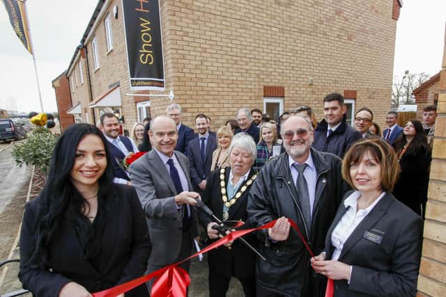 Larkfleet Homes CEO Karl Hick (centre left) and Market Deeping mayor Xan Collins officially open the new show home at Deeping Meadow