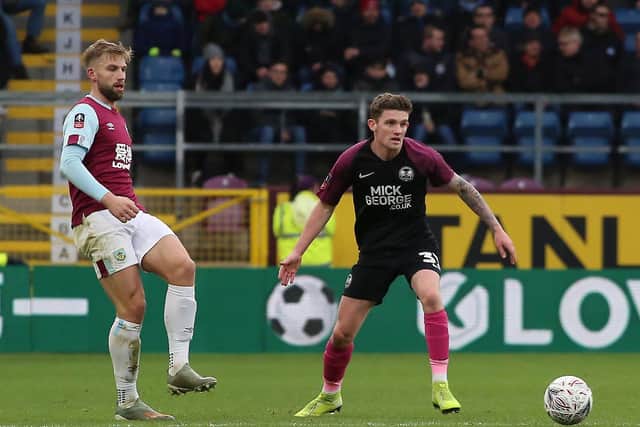 Kyle Barker (right) in action for Posh at Burnley. Photo: Joe Dent/theposh.com.