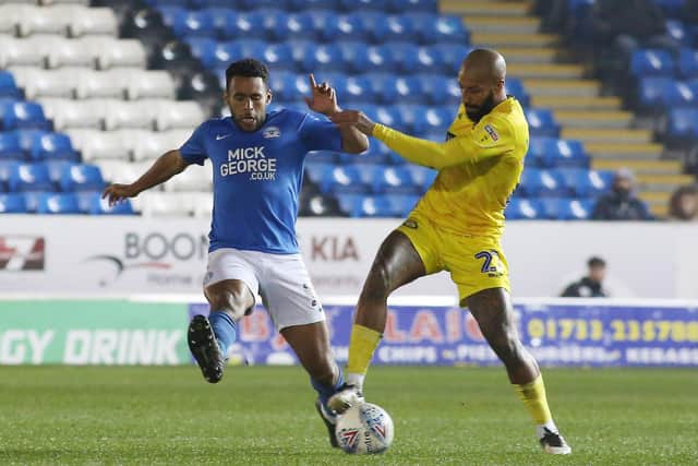 The experience of Posh defender Nathan Thompson (left) will be vital in the final stages of the promotion battle.
