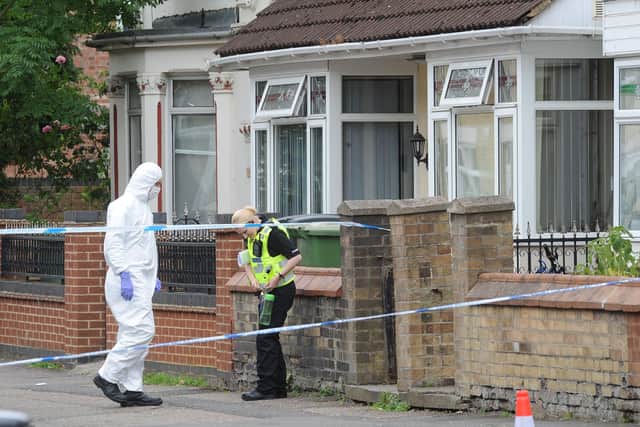 Police at the murder scene in Cromwell Road EMN-190207-152748009