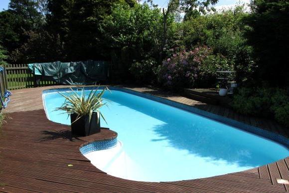 Decking surrounds the attractive swimming pool that forms part of the Goathland property