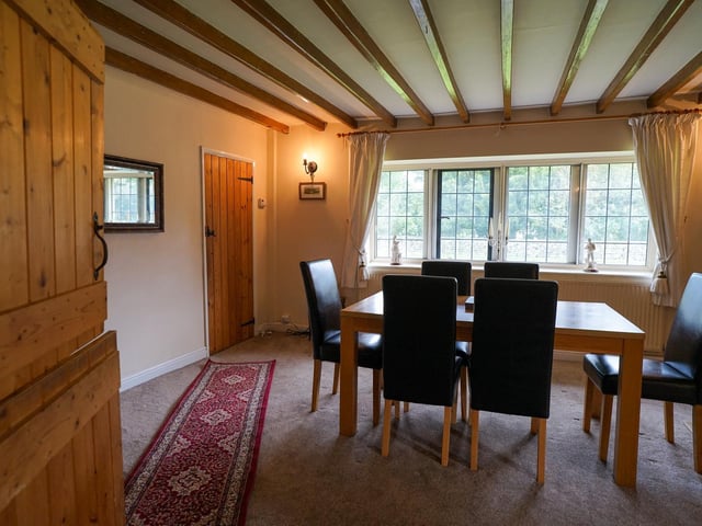 Another surprisingly spacious room that admits plenty of natural light through wide windows.