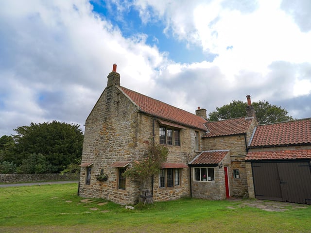 Greenery surrounds the substantial village property