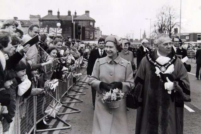 4th April 1985. The Queen accompanied by the Lord Mayor of Harrogate does a walkabout in Station Parade, Harrogate.