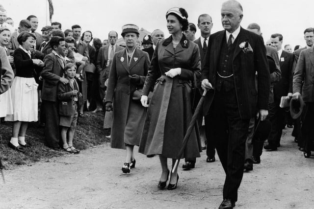 The Queen accompanied by Sir John Dunnington-Jefferson, and followed by the Princess Royal and the Duke of Edinburgh tours the Great Yorkshire Showground at Harrogate