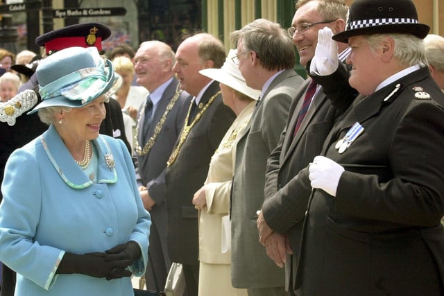 Della Cannings, Chief Constable of North Yorkshire Police, wearing the 'dress uniform' as she meets HM The Queen in Ripon marketplace in 2004.