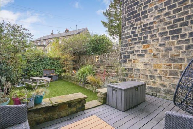 The enclosed and low maintenance garden is ideal for sitting out and relaxing.   There is a decked terrace, an artificial lawn and established borders.
