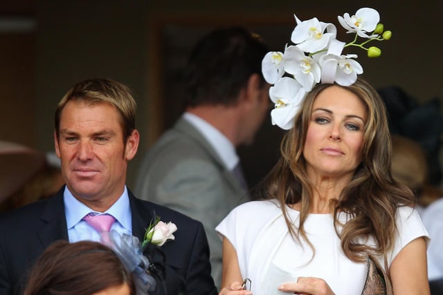 Shane Warne and Elizabeth Hurley look on at the Crown Oaks presentation during Crown Oaks Day at Flemington Racecourse on November 3, 2011 in Melbourne, Australia. (Photo by Mark Dadswell/Getty Images)