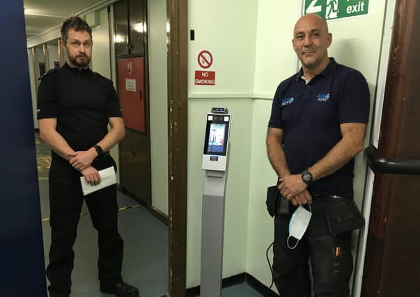 Custody Sergeant Graham Clifton and Chris Christophi of Ace4cctv with the thermal imaging scanner at Peterborough’s Thorpe Wood Police Station.