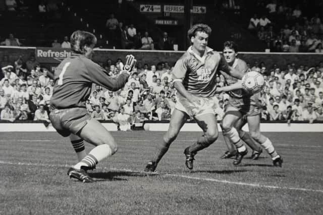 Mick Gooding (right) in action for Posh.