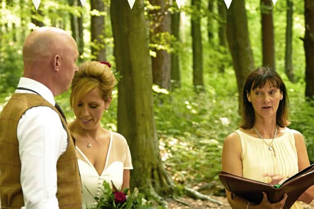 Sophie Burkett conducting a humanist wedding ceremony - but currently couples still have to make it legal at a register office. EMN-200107-143316001