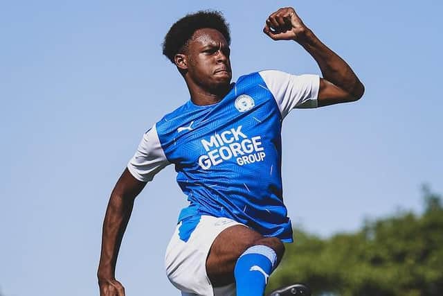 Ricky-Jade Jones celebrates the new Posh home kit launch.
