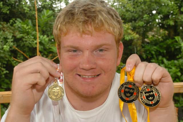 Dan Tinkler with his English Schools Athletics Championship medals.