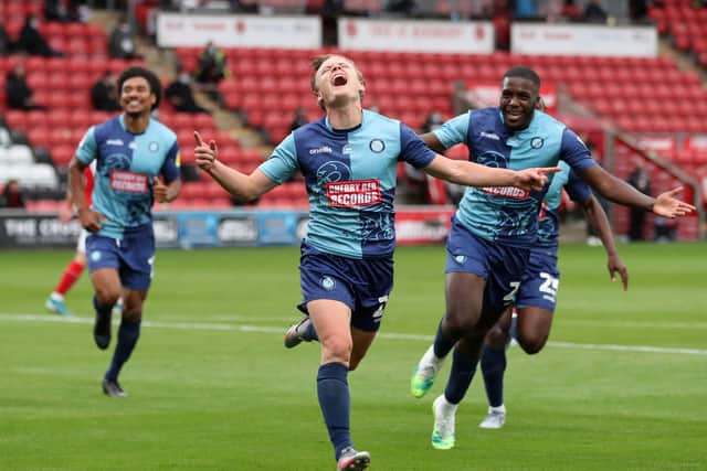 Wycombe players celebrate their play-off semi-final success over Fleetwood. Photo: Martin Rickett/PA Wire.