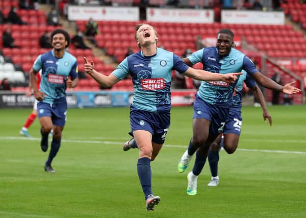Wycombe players celebrate their play-off semi-final success over Fleetwood. Photo: Martin Rickett/PA Wire.