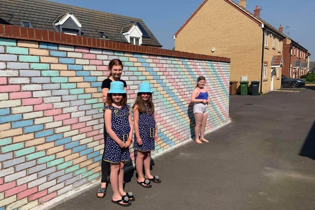 The amazing Rainbow Wall created byIsla and Evie Friel (8) Tegan Friel (14) and neighbour Lilly Privett (10)