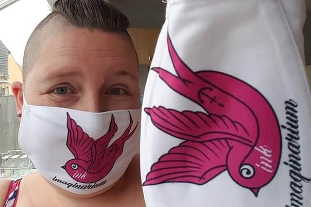 Masked up and ready to go - tattooist Hayley Evans. EMN-200807-130138001