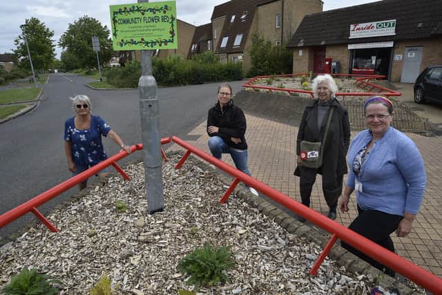 Cllr Heather Skibsted with locals Lorna Richardson, Sue Chislett and Daniela Ioneseu who have improved the planting areas at The Paynels, Orton Goldhay EMN-200307-144238009
