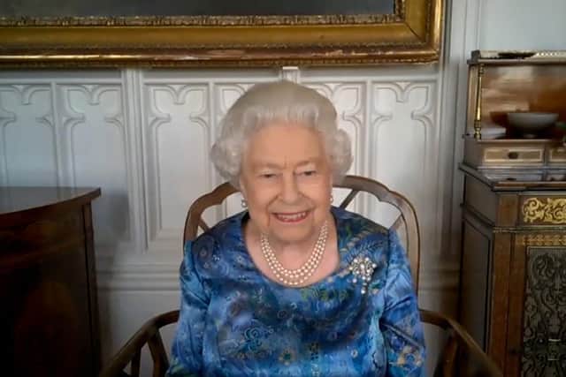 Her Majesty pictured during a video call from Windsor Castle with members of the Armed Forces based across the globe. Picture: Buckingham Palace/PA Wire