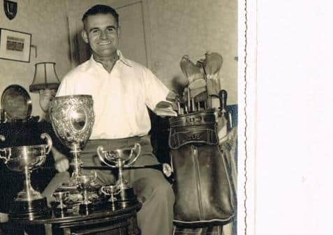 Martin Bains with some of the Milton Golf trophies he's accumulated over the years.