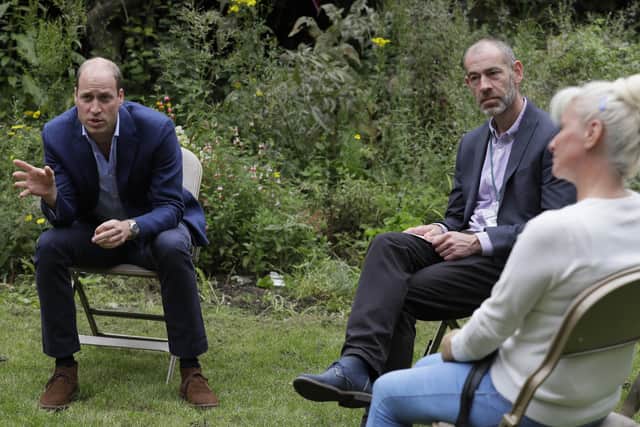 The Duke of Cambridge speaks with service user Regina Paskovskaja (right) and Chief Executive Steven Pettican during a visit to the Garden House part of the Peterborough Light Project, a charity which offers advice and support to rough sleepers.Picture: Kirsty Wigglesworth/PA Wire