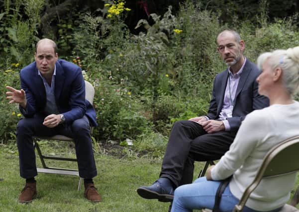 The Duke of Cambridge speaks with service user Regina Paskovskaja (right) and Chief Executive Steven Pettican during a visit to the Garden House part of the Peterborough Light Project, a charity which offers advice and support to rough sleepers.Picture: Kirsty Wigglesworth/PA Wire