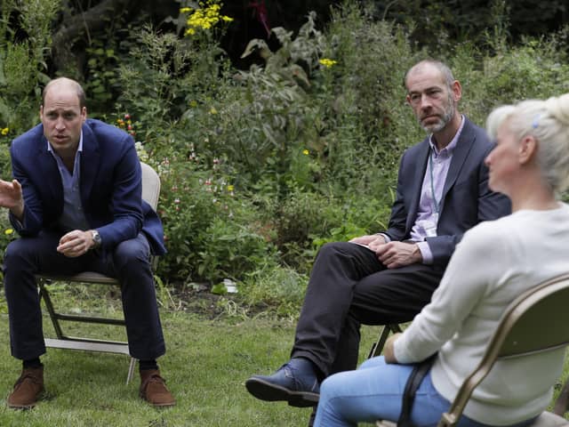 The Duke of Cambridge speaks with service user Regina Paskovskaja (right) and Chief Executive Steven Pettican during a visit to the Garden House part of the Peterborough Light Project, a charity which offers advice and support to rough sleepers.Picture: Kirsty Wigglesworth/PA Wire