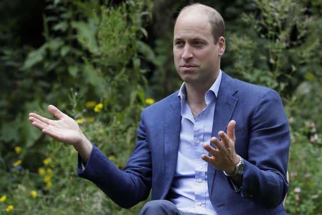 The Duke of Cambridge speaks with service users during a visit to the Garden House part of the Peterborough Light Project. Picture: Kirsty Wigglesworth/PA Wire.