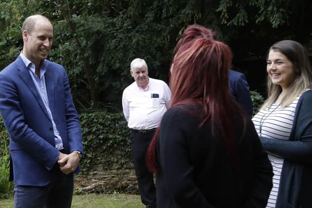 The Duke of Cambridge speaks with Lauren Salisbury, Senior Project Worker for Light Project (right) and Kelly Slack, Rough Sleeper Outreach Officer for Peterborough City Council during a visit to the Garden House part of the Peterborough Light Project. Picture: Kirsty Wigglesworth/PA Wire