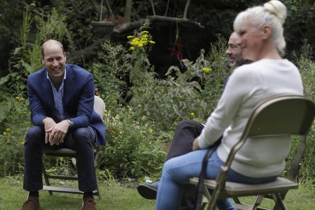 The Duke of Cambridge speaks with service user Regina Paskovskaja (right) and Chief Executive Steven Pettican during a visit to the Garden House part of the Peterborough Light Project. Picture: Kirsty Wigglesworth/PA Wire
