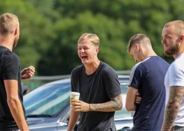 Posh defender Frankie Kent is all smiles as he turned up to have a Covid-19 test at the club training ground. Photo: Jake Baxter.