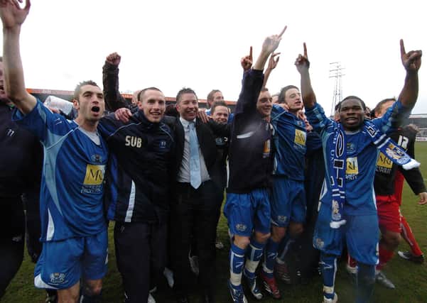 Posh celebrate promotion from League Two at Hereford in April 2008.